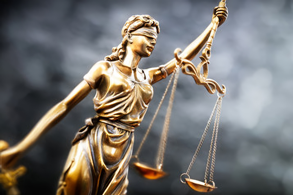 A statue of lady justice holding the scales.