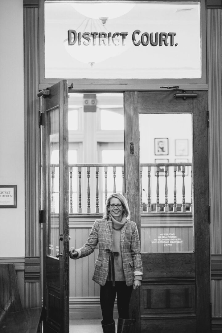 Jill Edinger standing in the doorway of a Colorado courthouse